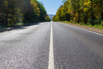 Fototapeta premium Asphalt road or highway with road markings
