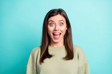 Fototapeta premium Photo portrait of screaming amazed woman isolated on vivid turquoise colored background