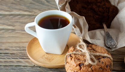 Two cups of freshly brewed espresso on wooden table. coffee beans on light wooden table, rustic style, homemade.