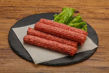 Raw beef sausages with spices