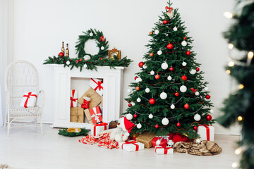 White room christmas tree pine fireplace with new year decoration gifts