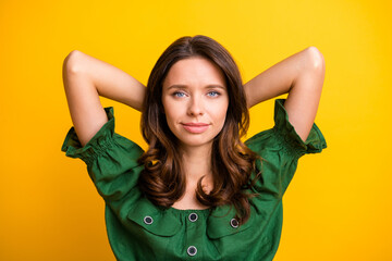 Top above high angle view photo of serious woman hold hands behind head peaceful mood rest isolated on yellow color background