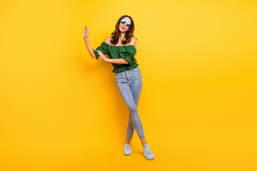 Fototapeta na wymiar Full length photo of carefree young cool happy woman dance weekend break isolated on shine yellow color background