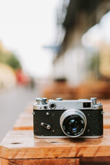 Vintage camera on a wooden surface close-up