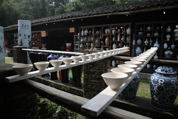View of Drying Porcelain bowls clay body on row of wooden boards at Ancient ceramic Kiln in...