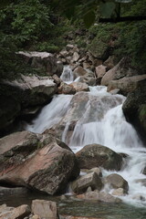 Fototapeta na wymiar View of creek and waterfall at Dazhang mountain, Crouching Dragon valley, (Chinese: Dazhangshan, Wolonggu), Wuyuan county, Jiangxi Province, China