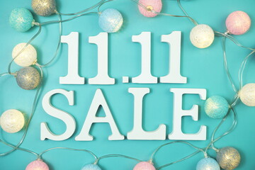 11.11 Sale alphabet letter with LED cotton balls on blue background