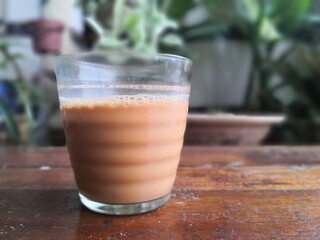 glass of tea on wooden table