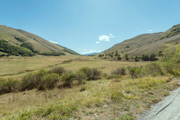 Fototapeta premium meadows and green slopes at Godi pass, Abruzzo, Italy