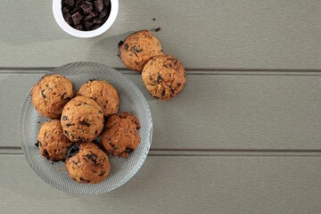 Top View Chocolate Chip Cookies Background with Copy Space on Gray Wooden Table. Homemade Food/Snack for Kids