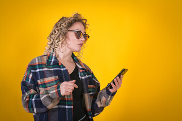 curly woman using smartphone