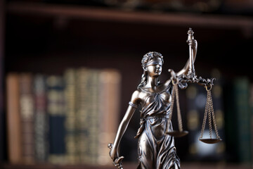 Fototapeta na wymiar Justice concept. Judge chamber. Themis statue on brown shining desk. 