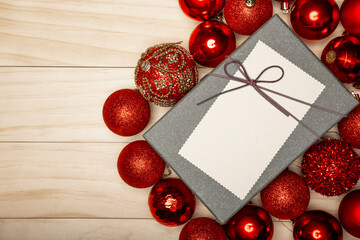 Naklejka na ściany i meble Red Christmas ornamental baubles and a box of present.
