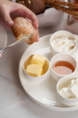 Woman having healthy breakfast at hotel restaurant