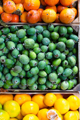 Yellow and green fruit in boxes
