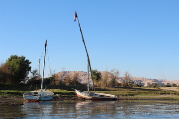 Two  sail  boats lying on the river shore in Luxor in Egypt