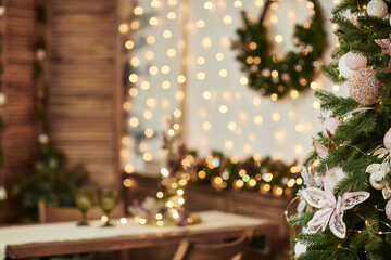 Christmas tree on blur background of christmas decorated interior. copy space for text