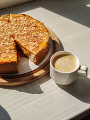 
caramel cheesecake with a cup of aromatic coffee

