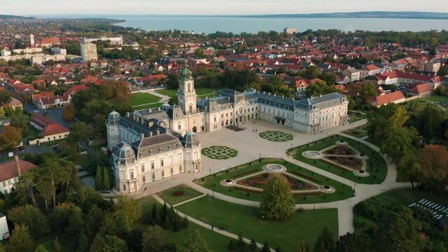 Keszthely, Hungary - 4K drone flying around the famous Festetics Palace (Festetics Kastely) at autumn season with lake Balaton at background. The town of Keszthely has been located in Zala county