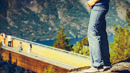 Tourist enjoying mountains fjord view, Norway