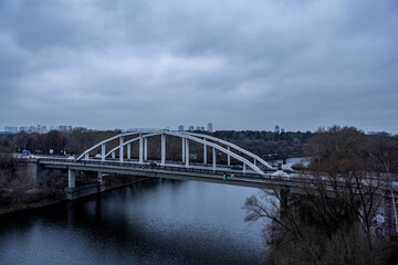 Naklejka premium red cable-stayed bridge and freeway at sunrise on winter morning
