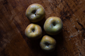 Renette apples on wooden table. Top view