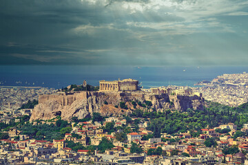 Fototapeta na wymiar Acropolis and Athens urban area panoramic view under impressive sky, Greece