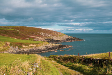 Fototapeta na wymiar The rocky Irish coastline over looking the Atlantic ocean from County Cork.