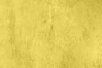 Fototapeta na wymiar Pastel olored yellow colored low contrast Concrete textured background with roughness and irregularities. 2021 color trend.