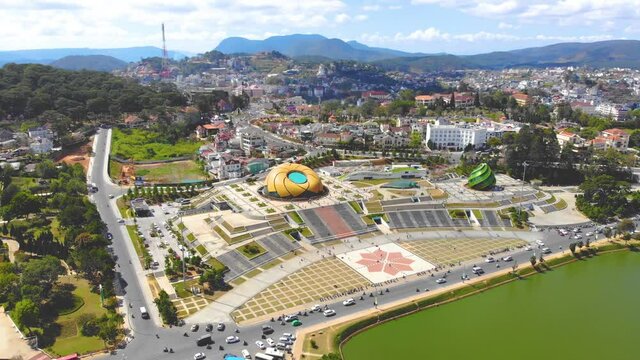 Aerial view of a Da Lat City with development buildings, transportation. Tourist city in developed Vietnam. Center Square of Da Lat city with Xuan Huong lake.