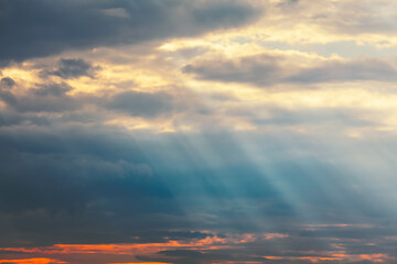 Diagonal sun rays in the dawn 