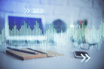 Stock market graph on background with desk and personal computer. Double exposure. Concept of financial analysis.