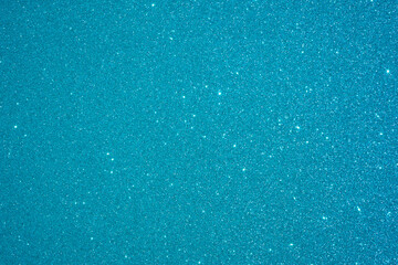 Blue Sparkling Lights Festive background with texture. Abstract Christmas twinkled bright Falling stars. Winter Card or invitation