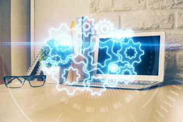 Multi exposure of business theme icons and work space with computer background. Concept of success.