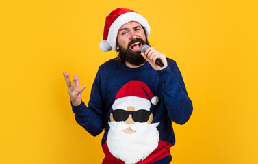 christmas music. bearded mature man wear knitted sweater sing in microphone. ready for celebration....