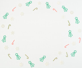 Christmas tree formed clips, Xmas canes, wooden snowflakes on white background. Back to school, Christmas in office concept. Xmas greeting card. Flat lay style with copy space.