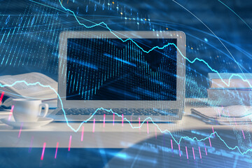 Financial chart drawing and table with computer on background. Multi exposure. Concept of...