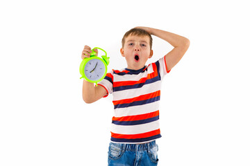 shocked cute boy holding alarm clock on white isolated background.