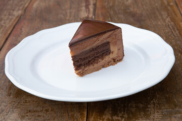 Delicious cake with three different kind of chocolate.