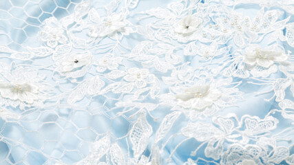 abstract background. Blue luxury satin fabric with guipure texture