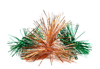 Glittering green and orange tinsel ornaments, Christmas decoration, isolated on white background