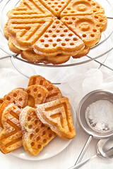 Cookies waffles in shape of heart on white background.