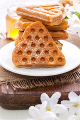 Morning breakfast with waffles in the shape of heart, homemade food