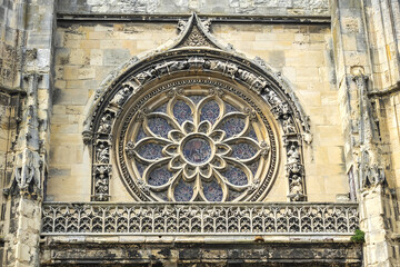 Built in heart of Fecamp XVI century Saint-Etienne church dominates now wearing Norman city: Renaissance portal, flamboyant Gothic steeple. Fecamp, Seine-Maritime department, Haute-Normandie, France.
