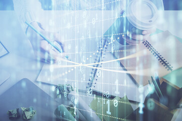 Double exposure of hands making notes background with technology and digital coding huds. Data learning concept.