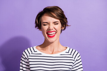 Portrait of funky pretty short brunette hairdo girl yelling wear stripped pullover isolated on violet color background