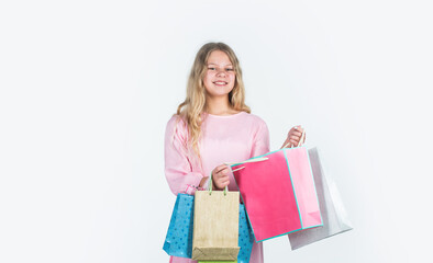 Fototapeta premium Shopping happiness. big sale. teen girl hold paper bag. buy gifts for holiday. shopaholic kid with purchase packages. happy child go shopping. black friday concept. kid on cyber monday