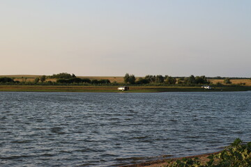 Naklejka premium sunset on the lake in summer
