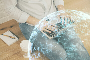 Media network theme hologram with man working on computer on background. Concept of internet...