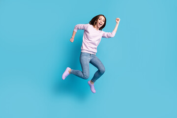 Fototapeta na wymiar Full size photo of excited active girl jump enjoy spring season discount wear violet purple pullover isolated over blue color background